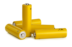 A group of yellow batteries sitting on top of each other.