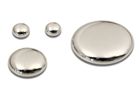 A set of four metal buttons with one larger button.